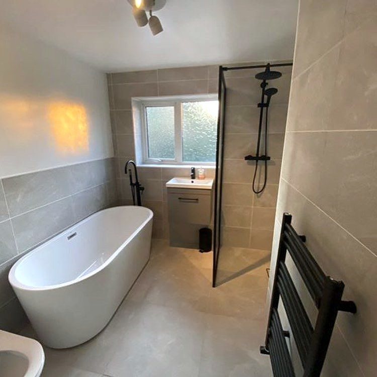 Completed bathroom with freestanding bath and walk-in shower