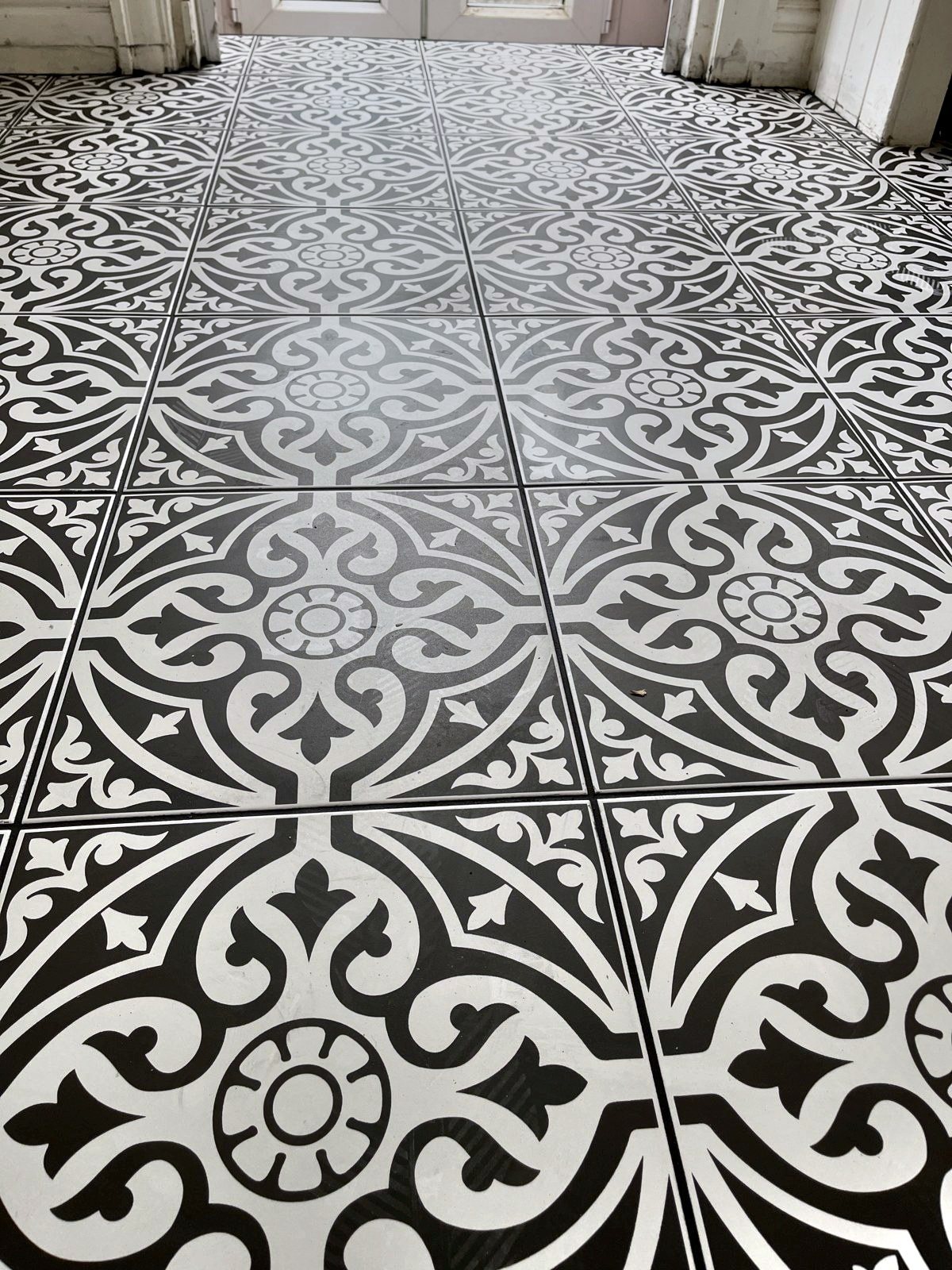 Black and white Victorian-pattern hallway floor